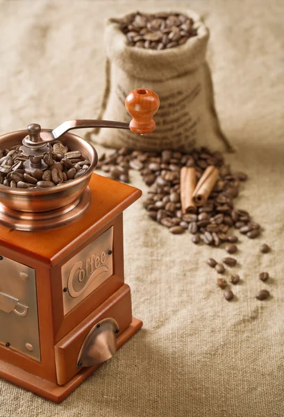 Coffee in bag cinnamon and coffee mill — Stock Photo, Image