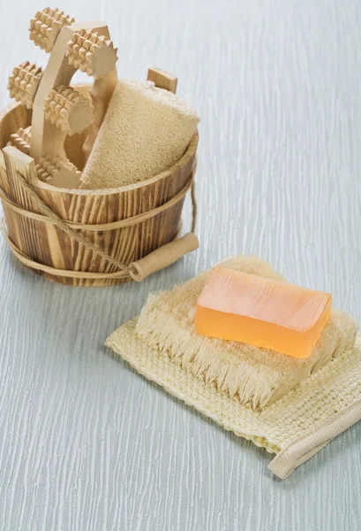 Bucket and soap on bast — Stock Photo, Image