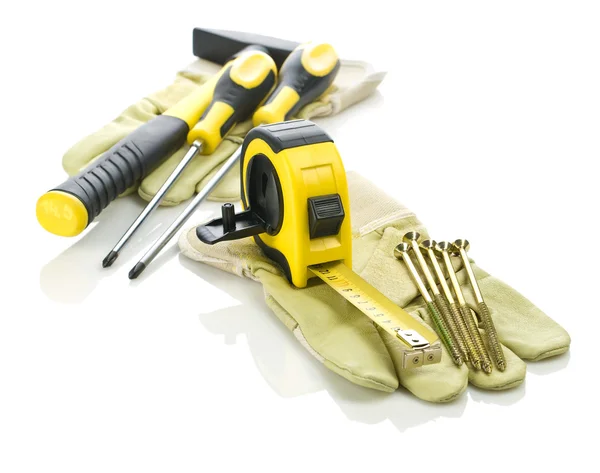 Handschuhe mit Werkzeug für den Bau — Stockfoto