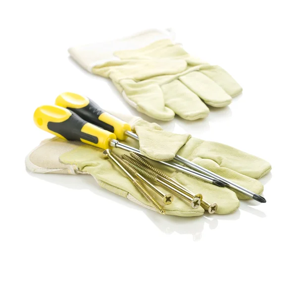 Handskar med skruvar och skruvmejslar — Stockfoto