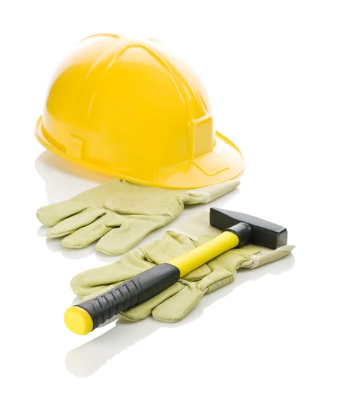 Gloves with hammer and helmet — Stock Photo, Image