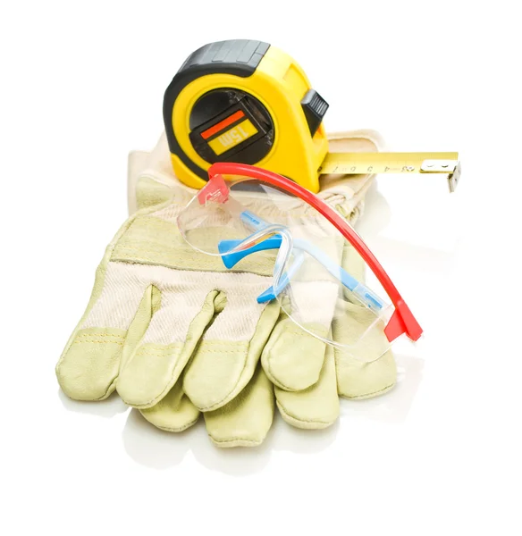 stock image Glasses and tapeline on gloves