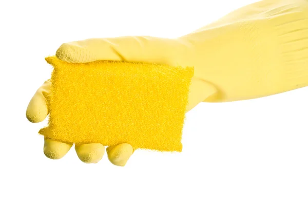 Hand in gele handschoen met spons — Stockfoto
