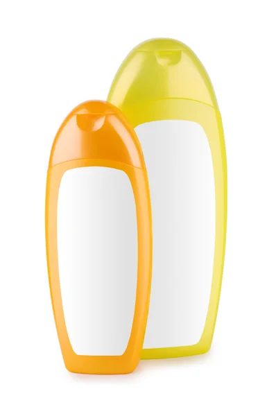 Oranje en gele fles geïsoleerd — Stockfoto