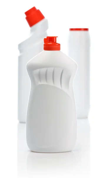 Bílé láhve s červenými deskami pro čištění — Stock fotografie