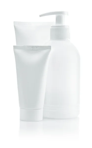 Dos tubos blancos y botella aislados — Foto de Stock