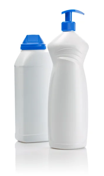 Weiße Flaschen mit blauen Deckeln — Stockfoto