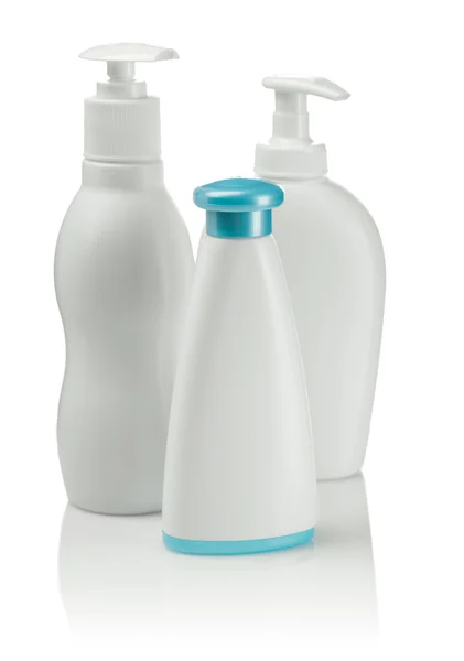 Drei weiße Pflegeflaschen — Stockfoto