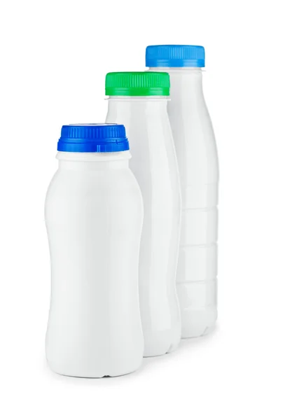 Trzy białe butelki na białym tle — Zdjęcie stockowe