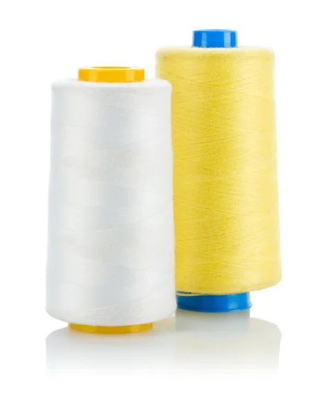 Yellow and white thread on spools isolated — Stock Photo, Image