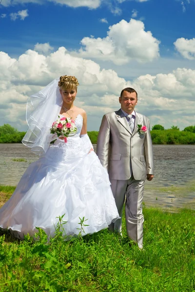 Wedding pair on coast of the river — Stock Photo, Image