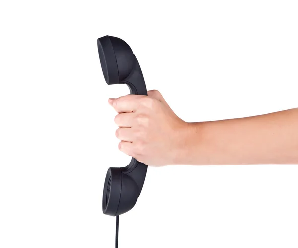 Mão segurar tubo de telefone preto — Fotografia de Stock