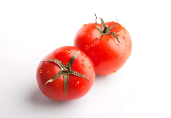 Dois tomates em branco — Fotografia de Stock