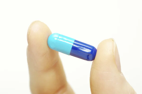 Finger Håller Piller Isolerad Vit — Stockfoto