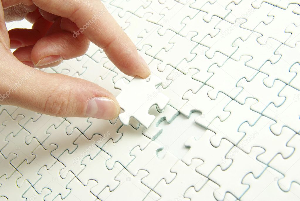 Hands holding a puzzle piece . business concepts