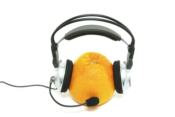 stock image Orange and headphones isolated on a white