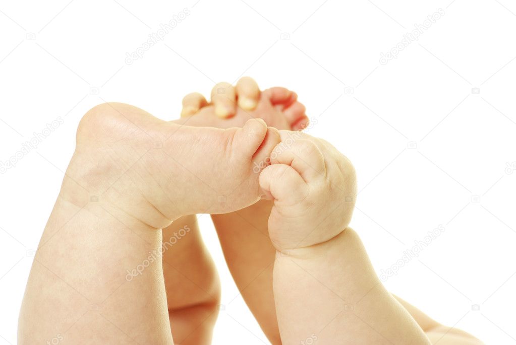 Newborn baby feet and hands isolated on white