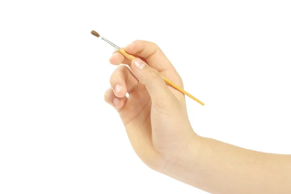 Brush in a hand — Stock Photo, Image