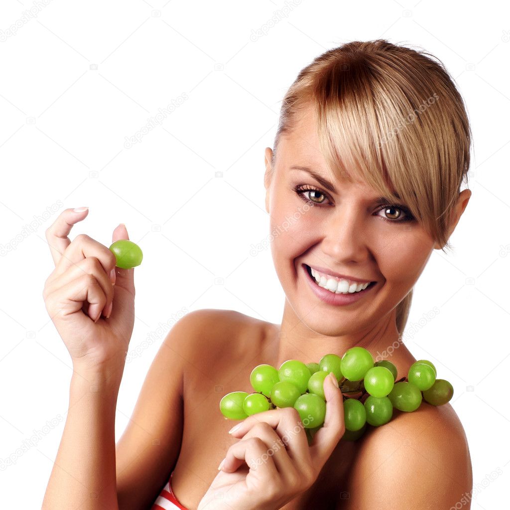 Beautiful young woman with bunch of grape.
