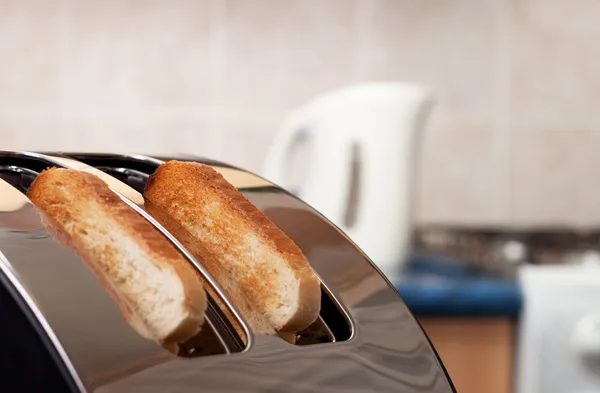 Bread toaster in the kitchen — Stock Photo, Image
