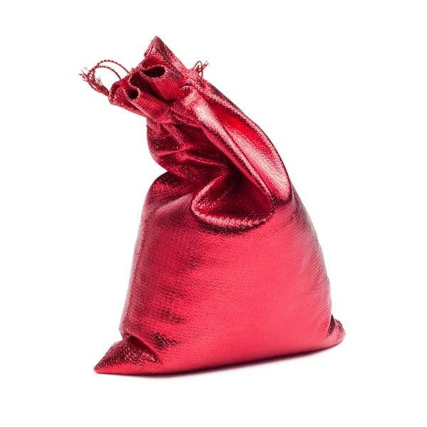 Červená vánoční taška s dárek nad bílá — Stock fotografie