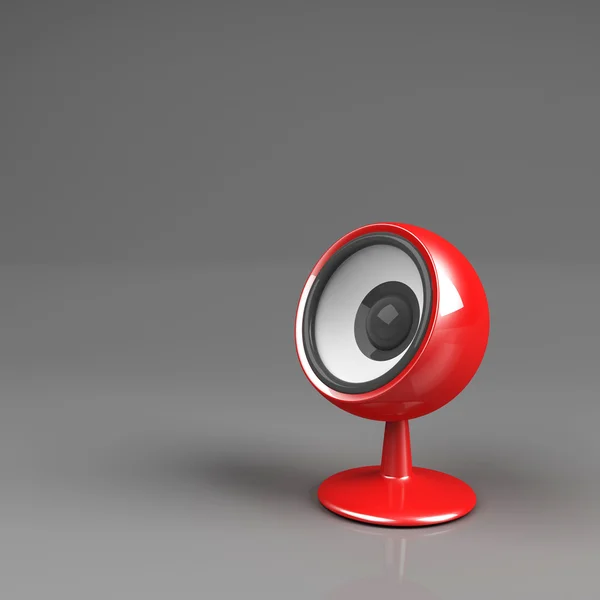 Red speaker on pedestal over grey — Stock Photo, Image