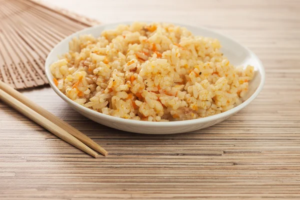 Stock image Bowl of cooked rice with chopsticks