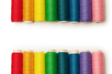 Rainbow colored threads set isolated over white background clipart