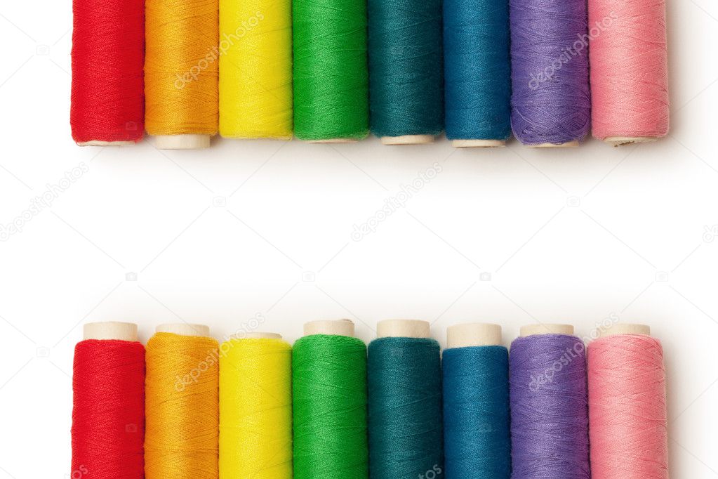 Rainbow colored threads set isolated over white background
