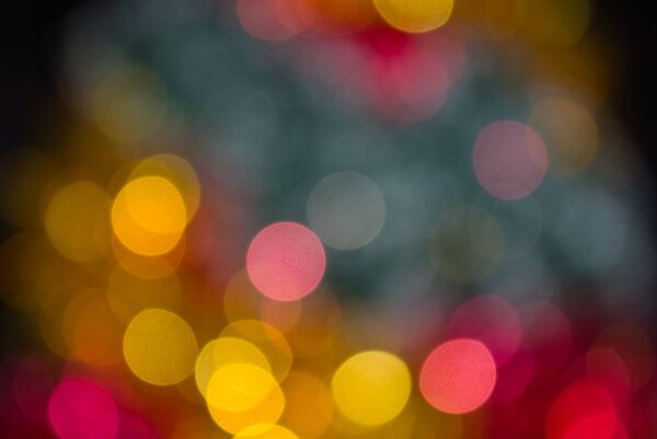 The colored abstract christmas lights as background