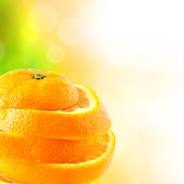 Juicy orange cut into slices — Stock Photo, Image