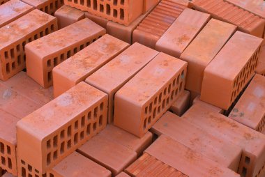 Red bricks silicate with apertures on building. clipart