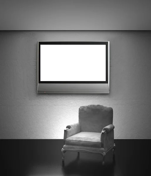 Fåtölj med LCD-tv på väggen — Stockfoto