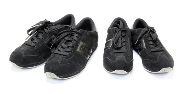 Paar schwarze Laufschuhe auf weißem Hintergrund — Stockfoto