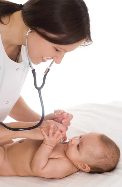 Doctor with newborn child Stock Image