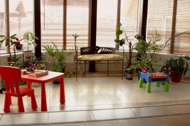 Nursery with toys and plants clipart