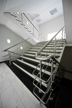 Staircase with a steel handrail clipart