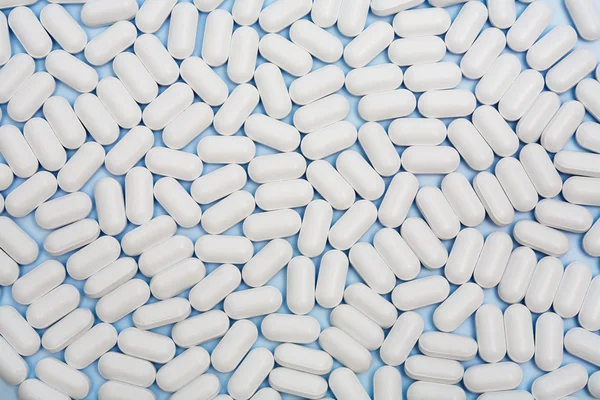 Muitas pílulas brancas — Fotografia de Stock