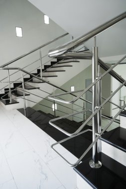 Staircase with a steel handrail clipart