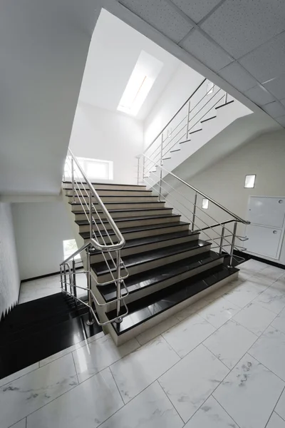Staircase with a steel handrail — Stock Photo, Image