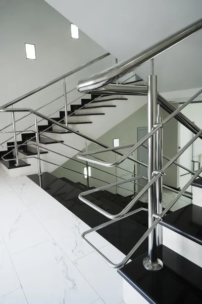 Staircase with a steel handrail — Stock Photo, Image