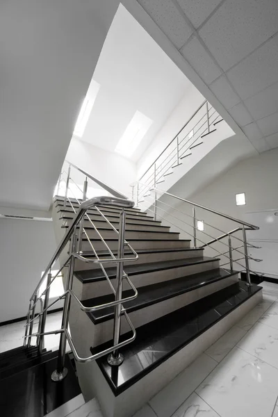 Marble staircase with a steel handrail — Stock Photo, Image