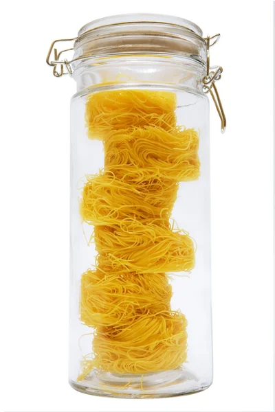 Spaghetti in glass jar — Stock Photo, Image