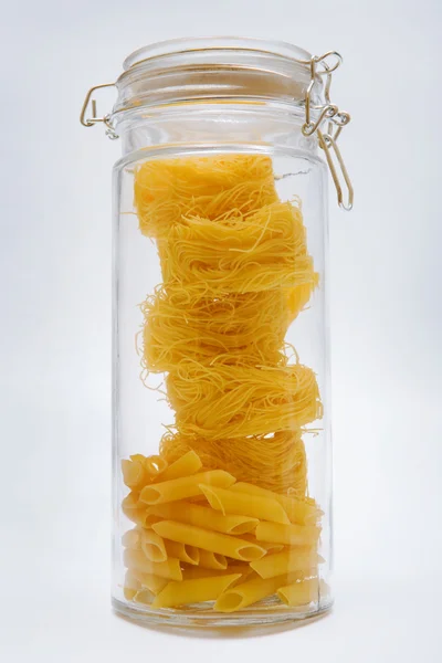 Pasta in glass can — Stock Photo, Image