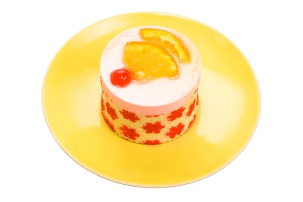 Cake with a cherry and an orange — Stock Photo, Image