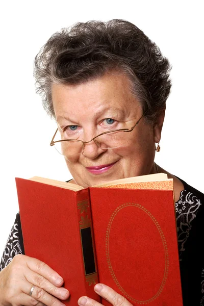 Old woman with the red book — Stock Photo, Image