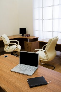 Laptop on a table clipart