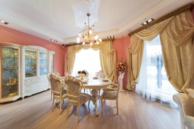 Beautiful white table and chairs in a modern apartment clipart