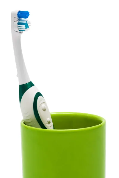 Diş fırçası bir yeşil cam — Stok fotoğraf