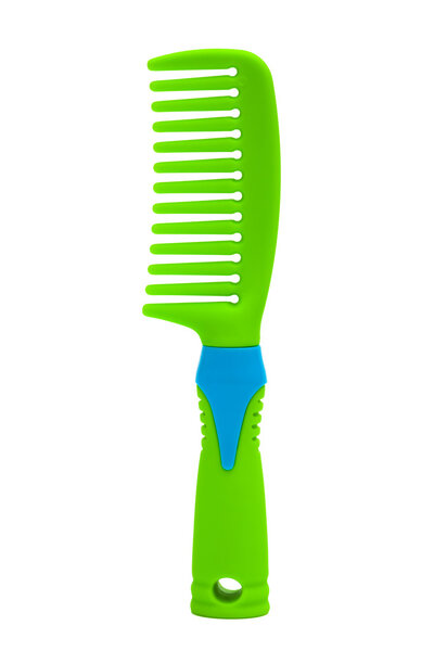 green plastic comb on a white background